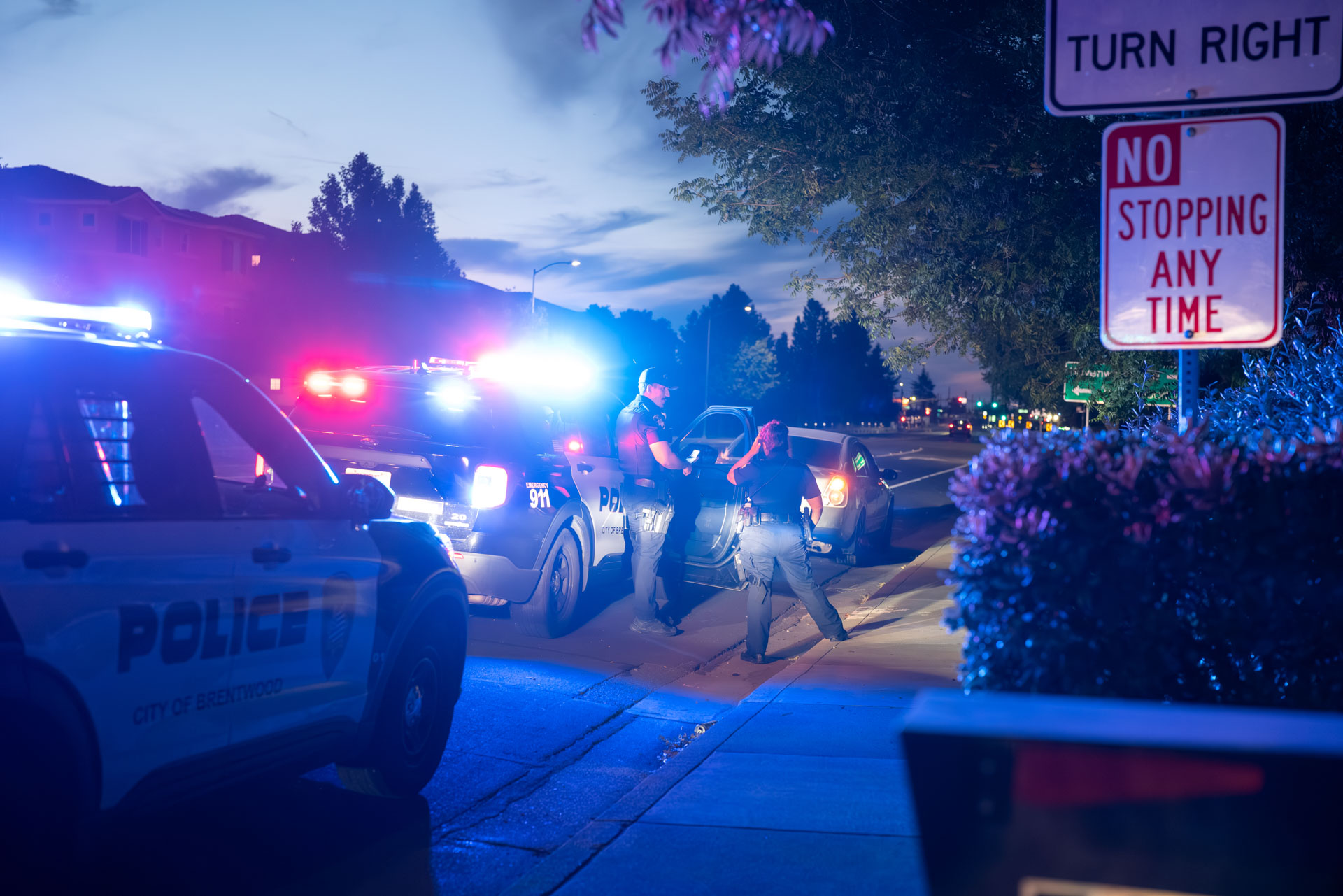 Brentwood Police patrol SUV at dusk with emergency lights on